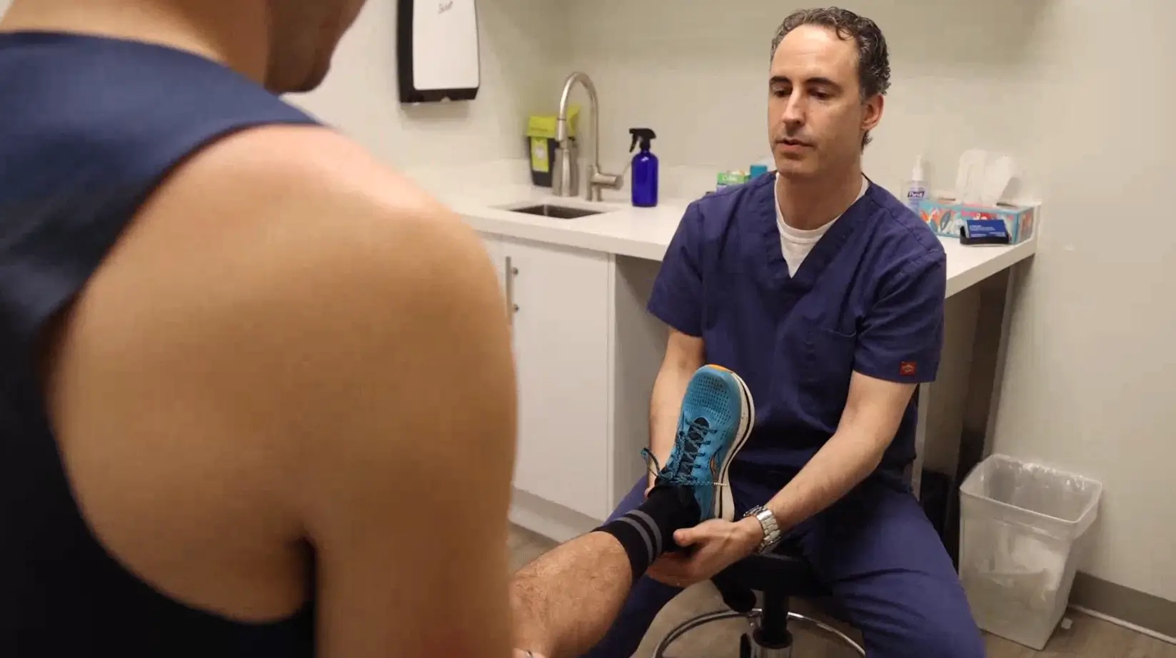 Dr. Darren Edelist conducting patient assessment Dr. Darren Edelist conducting patient assessment